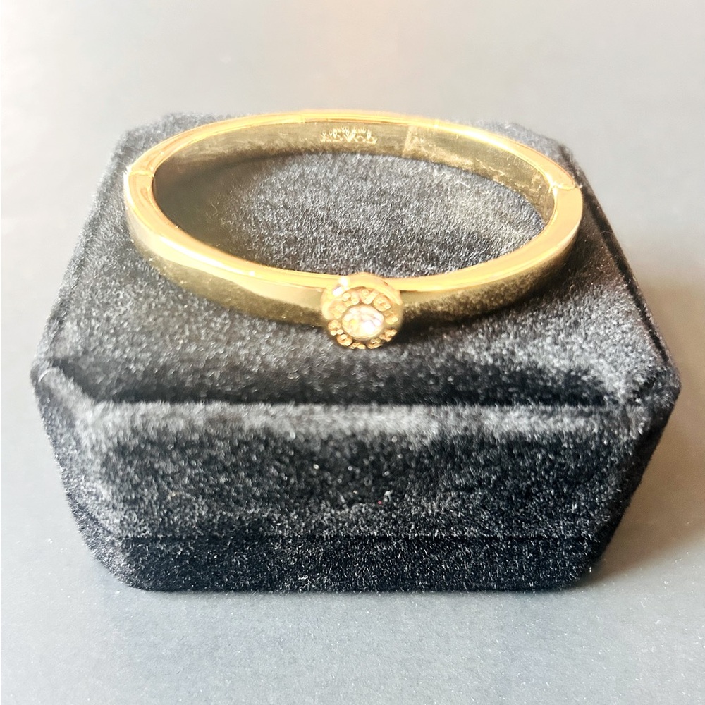 Coach bangle bracelet. Golden finish. NWT. Comes with velvety jewelry box!